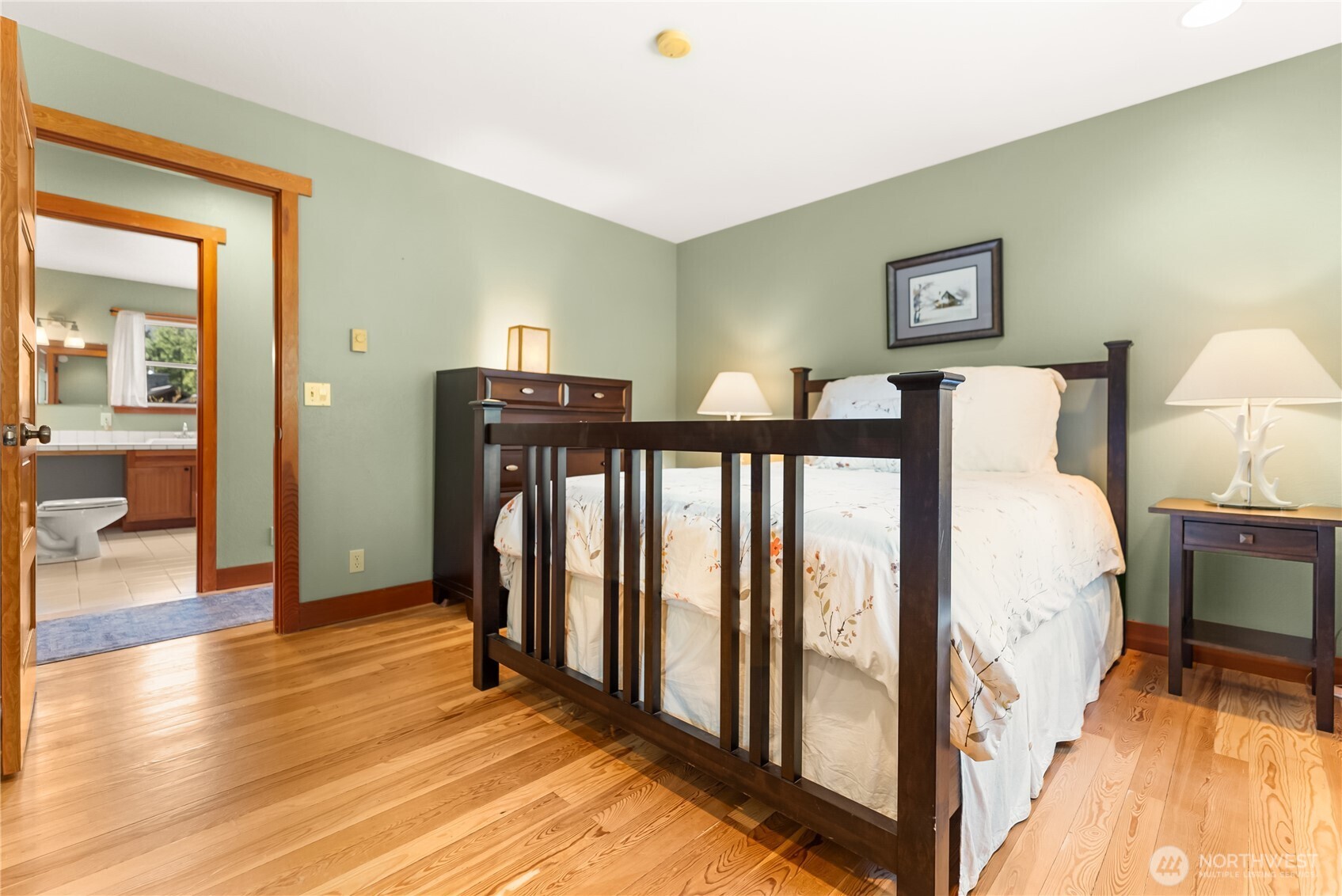 7 Last Chance Road Mazama, WA 98833 - Photo 11 of 40 a view of a bedroom with wooden floor and furniture
