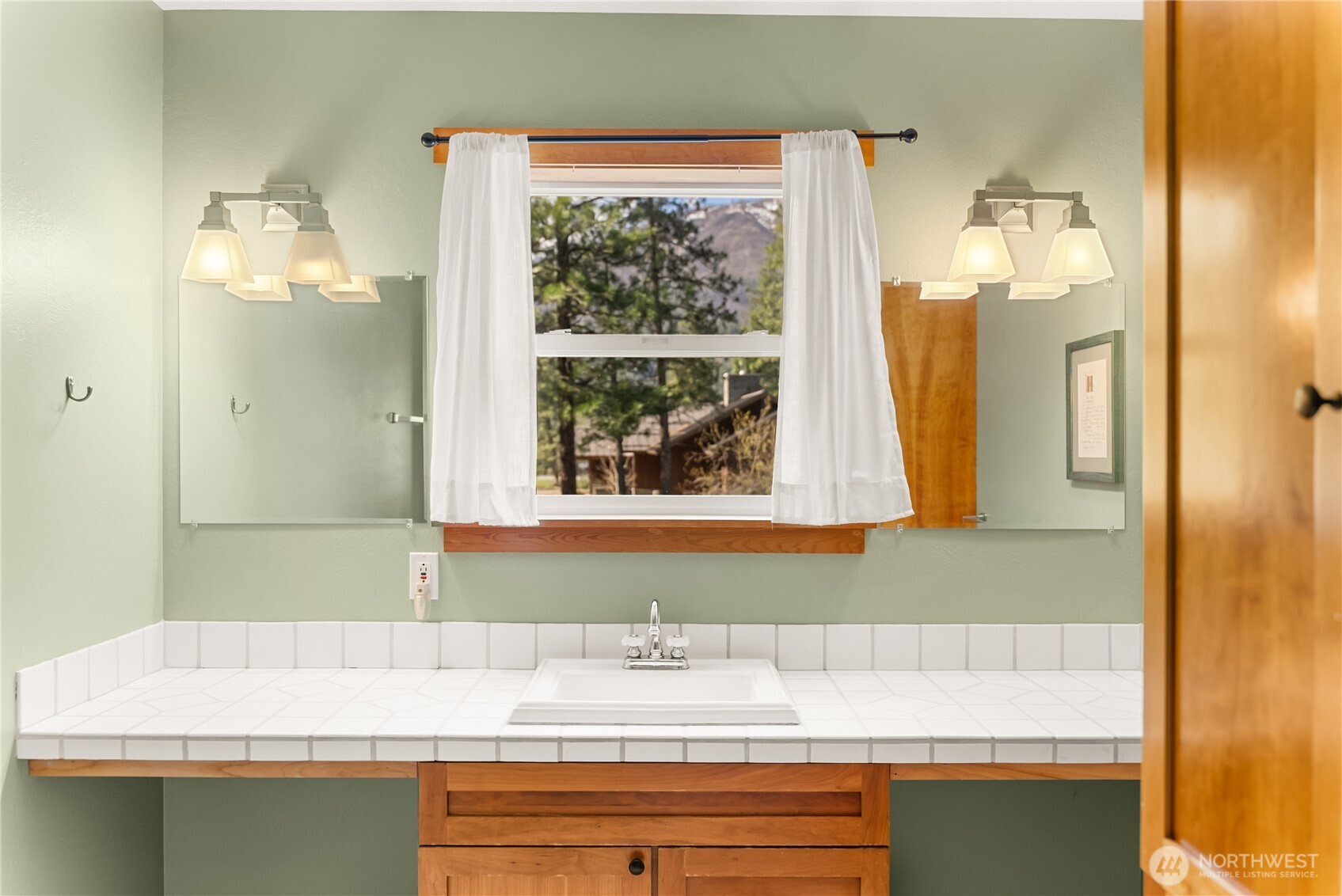 7 Last Chance Road Mazama, WA 98833 - Photo 13 of 40 a bathroom with a sink and a mirror