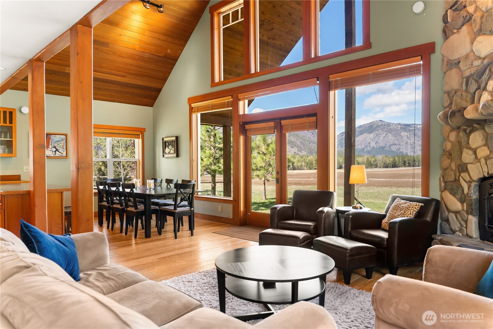 7 Last Chance Road Mazama, WA 98833 - Photo 23 of 40 a living room with furniture and a large window