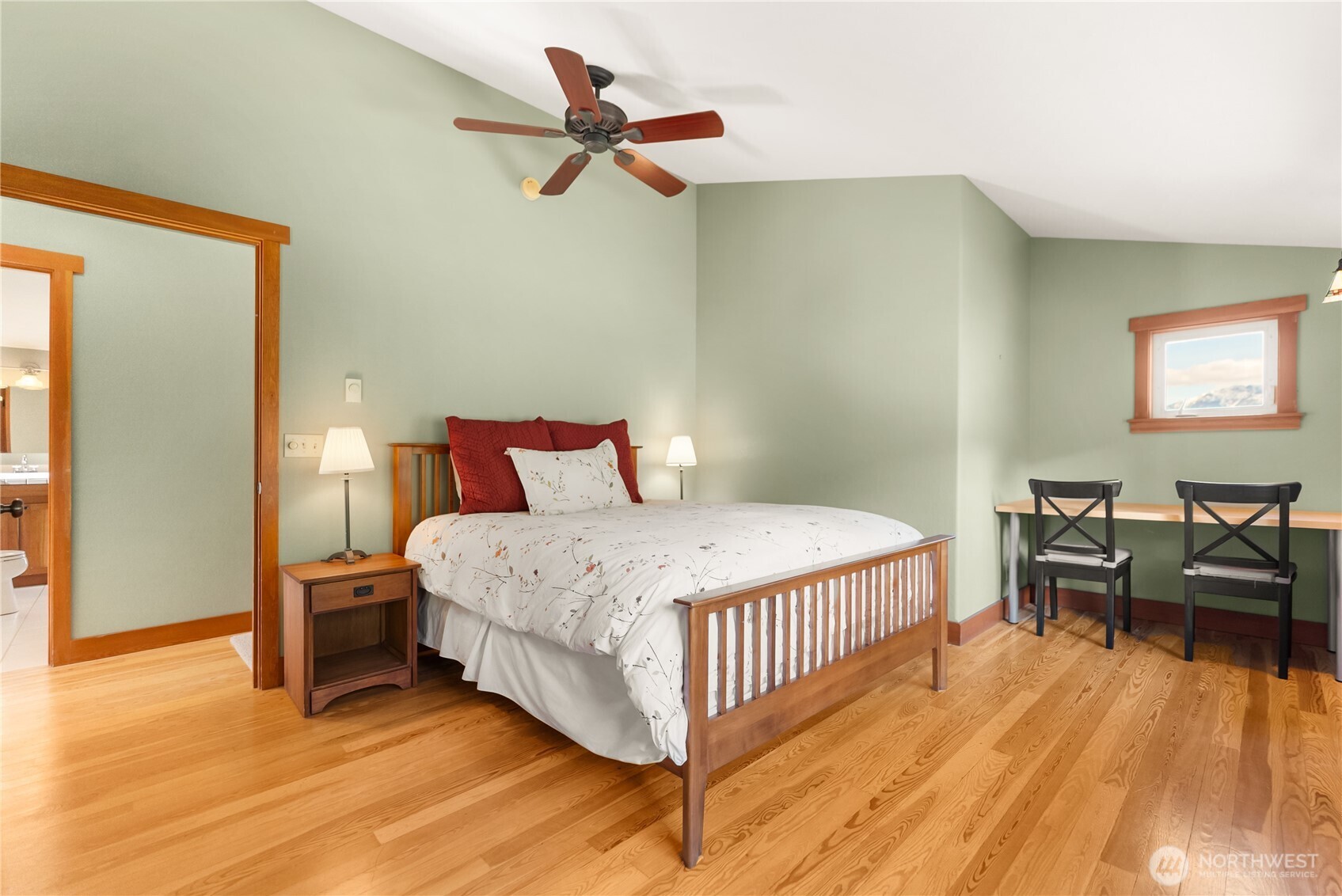 7 Last Chance Road Mazama, WA 98833 - Photo 26 of 40 a bedroom with a bed and wooden floor