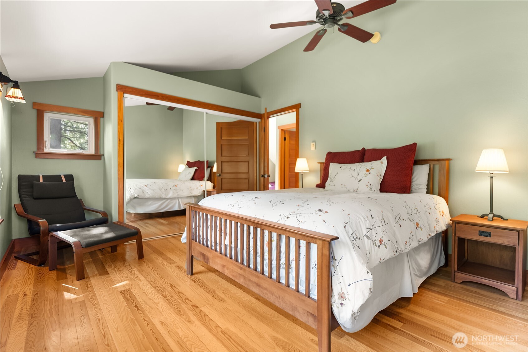 7 Last Chance Road Mazama, WA 98833 - Photo 27 of 40 a bedroom with a bed and wooden floor