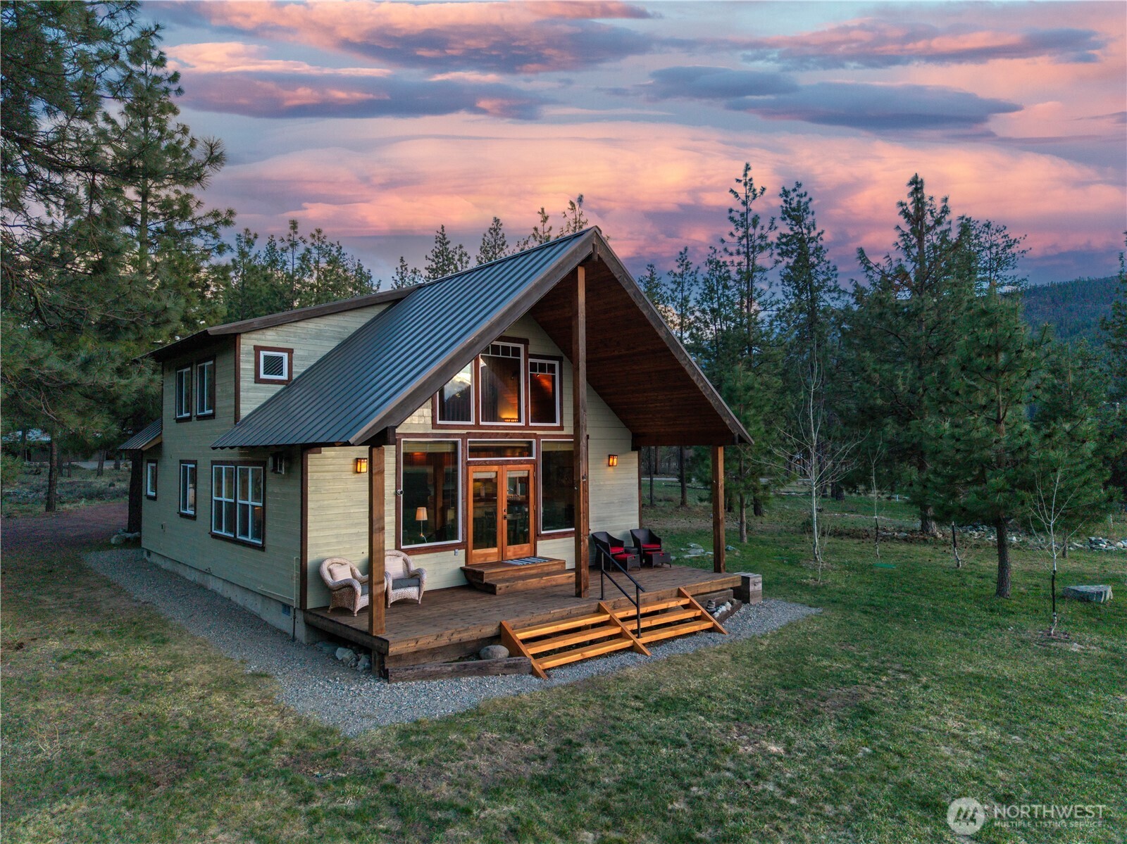 7 Last Chance Road Mazama, WA 98833 - Photo 3 of 40 a view of a house with backyard porch and sitting area