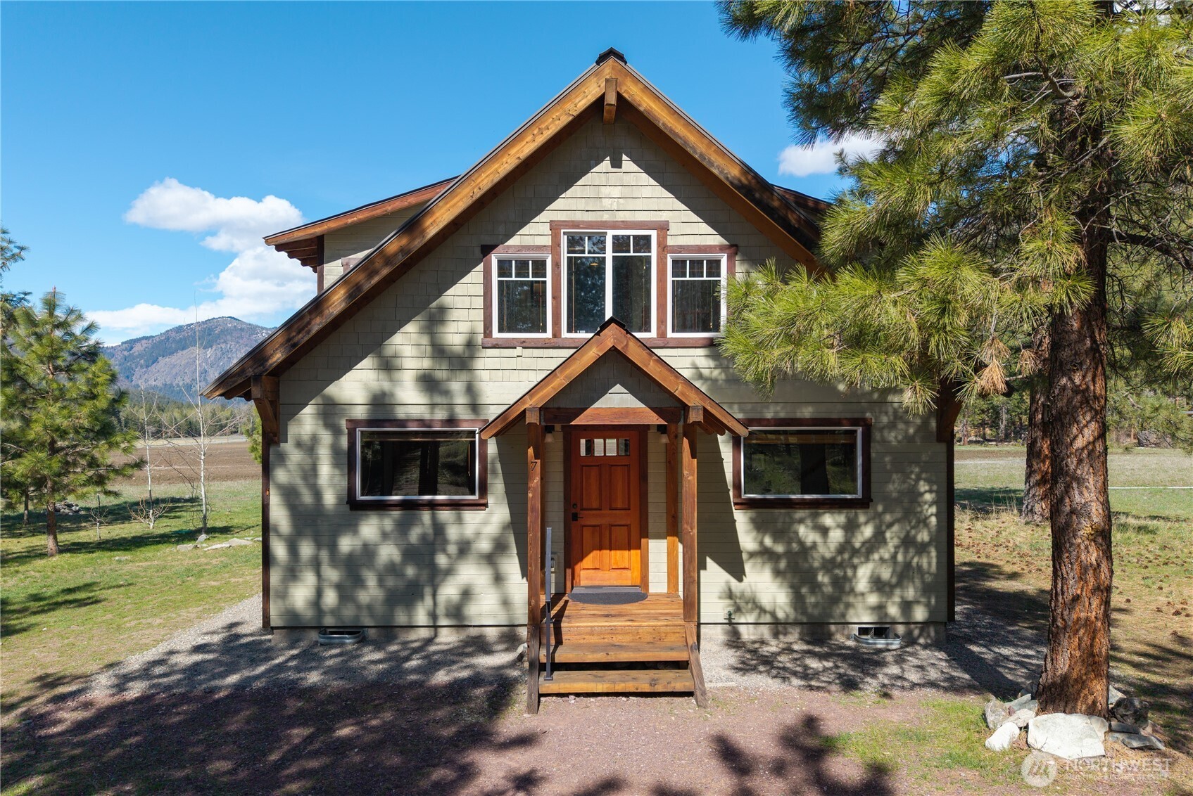 7 Last Chance Road Mazama, WA 98833 - Photo 36 of 40 a front view of a house with a yard