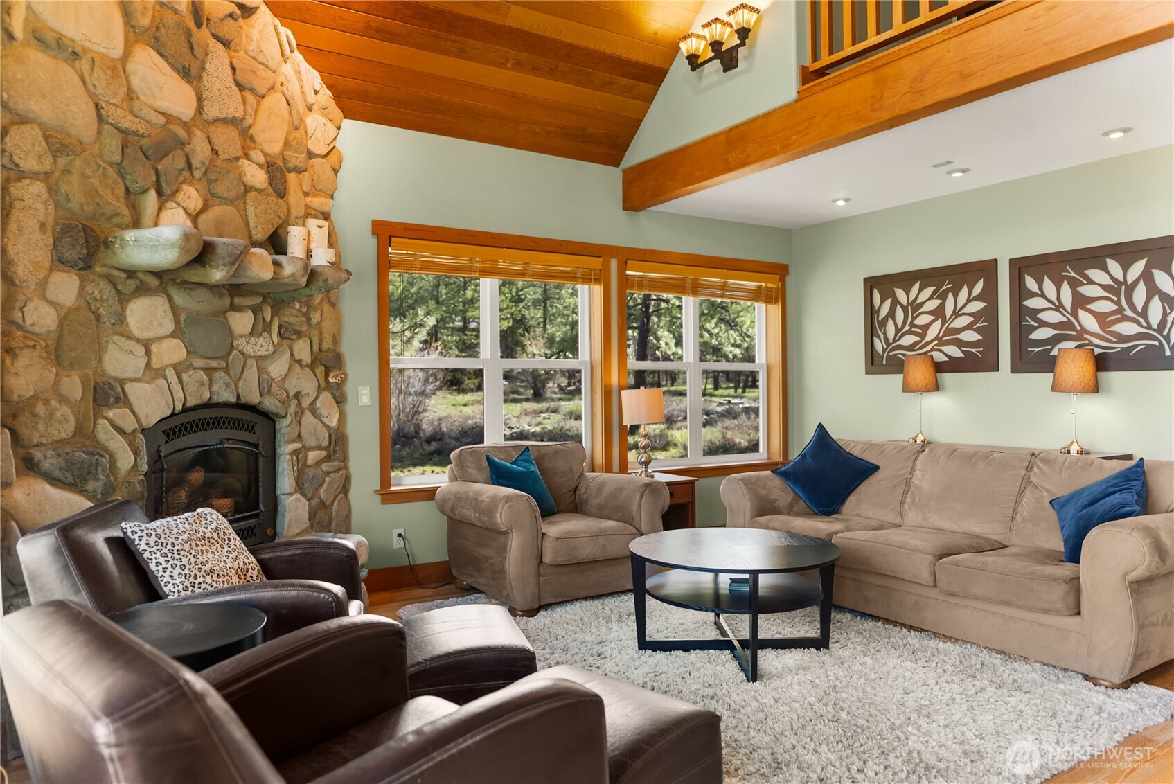 7 Last Chance Road Mazama, WA 98833 - Photo 5 of 40 a living room with furniture and a fireplace