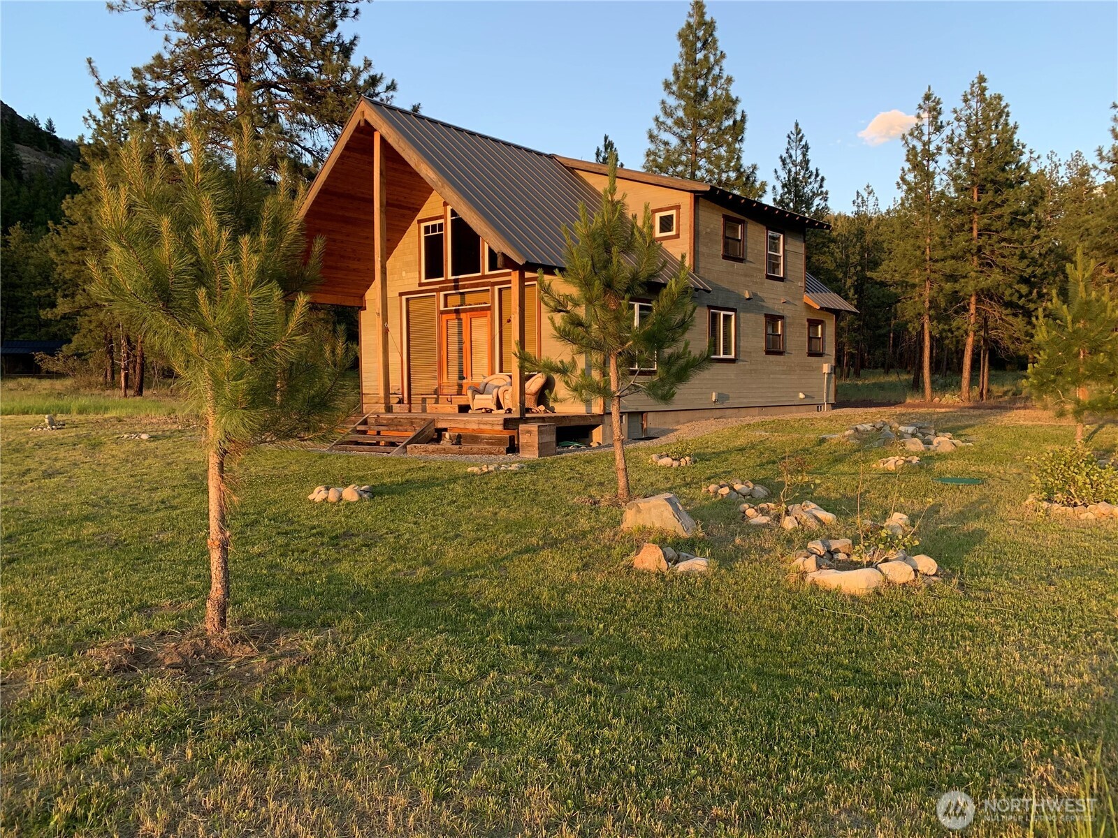 7 Last Chance Road Mazama, WA 98833 - Photo 7 of 40 a front view of a house with a yard