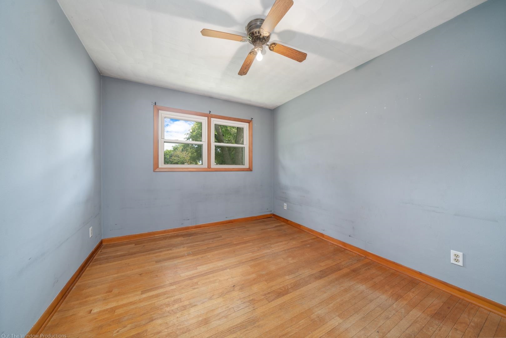 510 Elizabeth Road Oregon, IL 61061 - Photo 11 of 25 an empty room with windows and fan