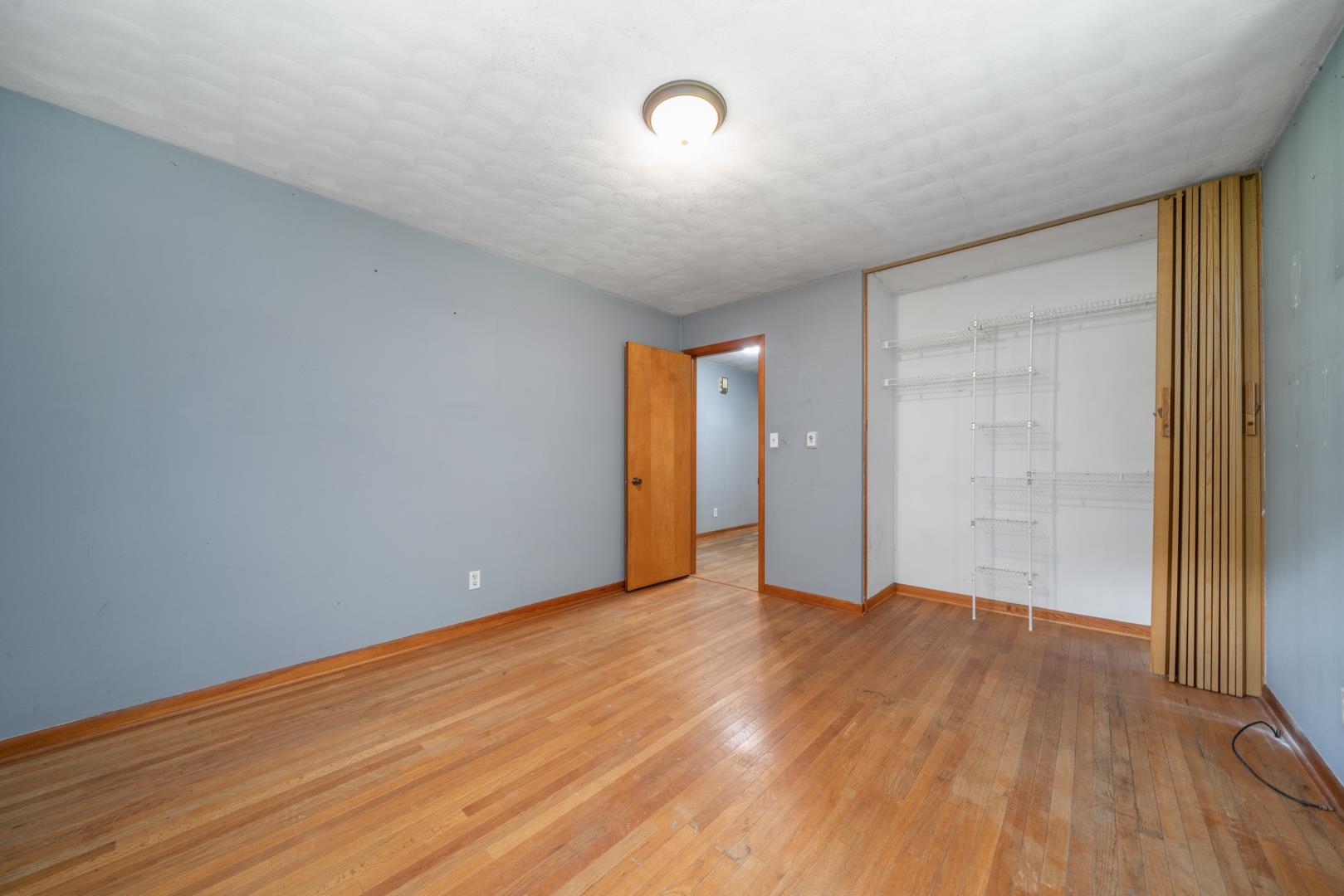 510 Elizabeth Road Oregon, IL 61061 - Photo 12 of 25 a view of an empty room with wooden floor