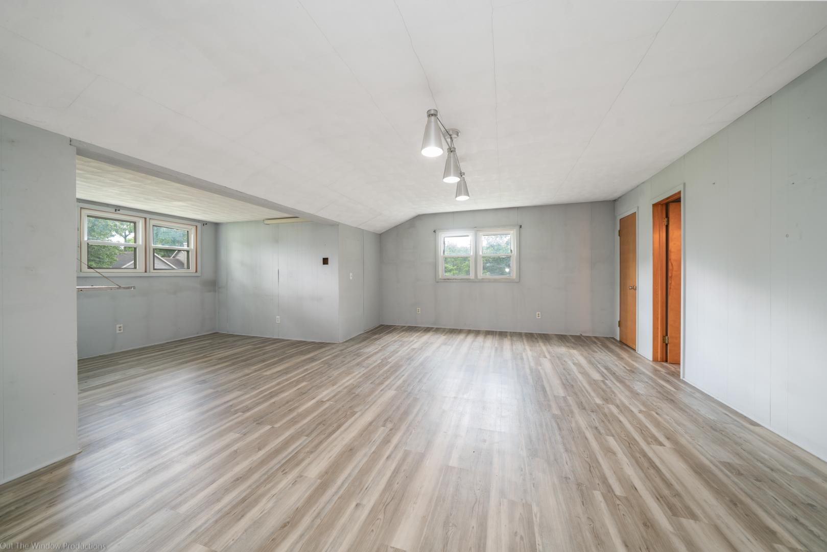 510 Elizabeth Road Oregon, IL 61061 - Photo 17 of 25 an empty room with wooden floor and windows