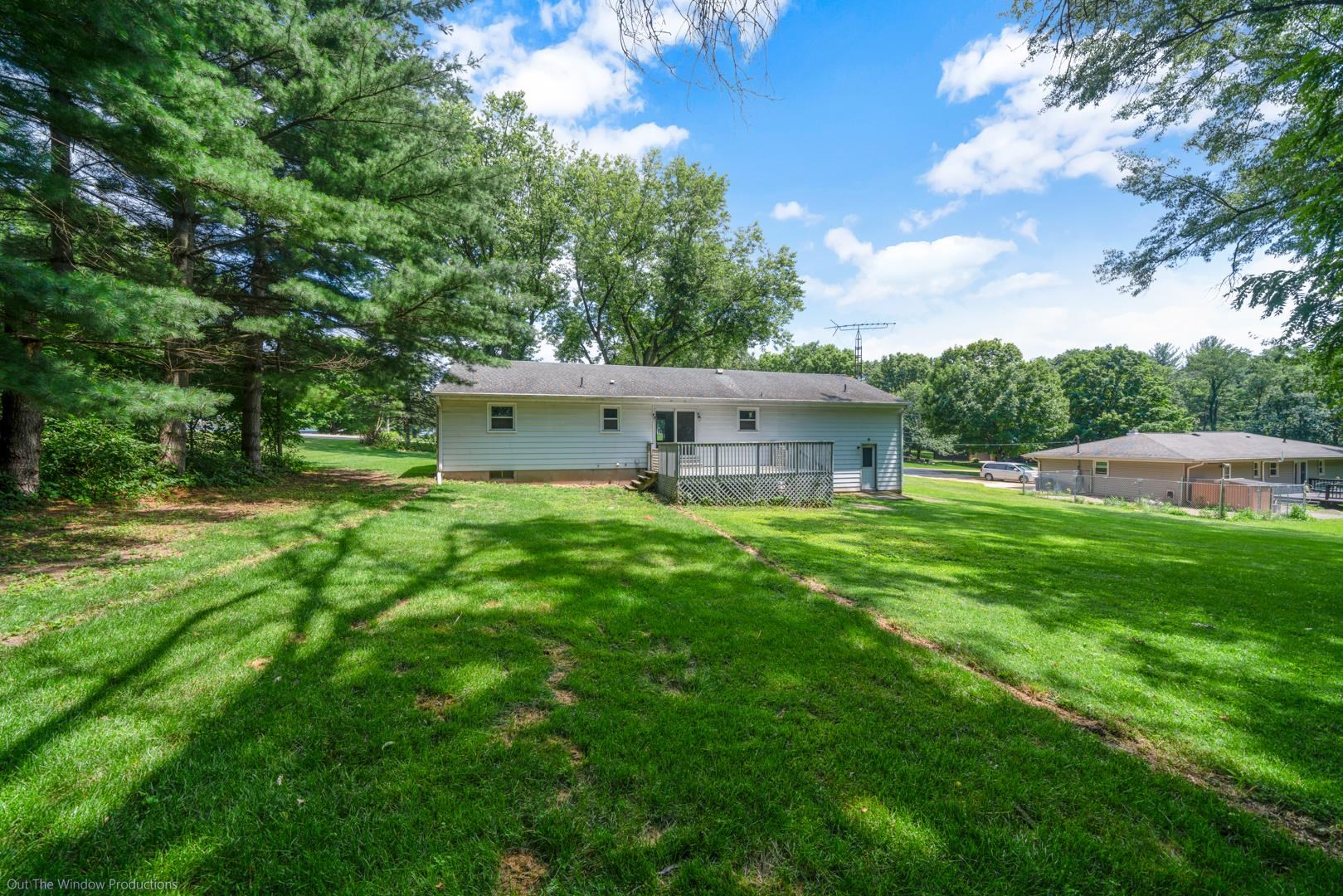 510 Elizabeth Road Oregon, IL 61061 - Photo 23 of 25 a view of a house with a big yard and large trees