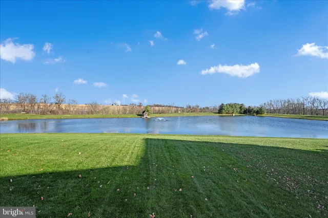 a view of a lake and houses in the back