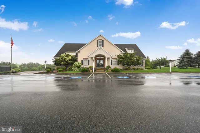 a view of swimming pool with a yard and plants