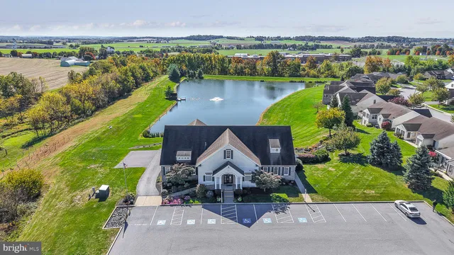 a aerial view of a house with a lake view