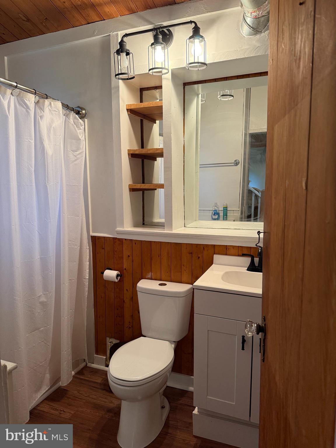1915 Bumpass Road Bumpass, VA 23024 - Photo 14 of 17 a bathroom with a toilet a sink and a shower