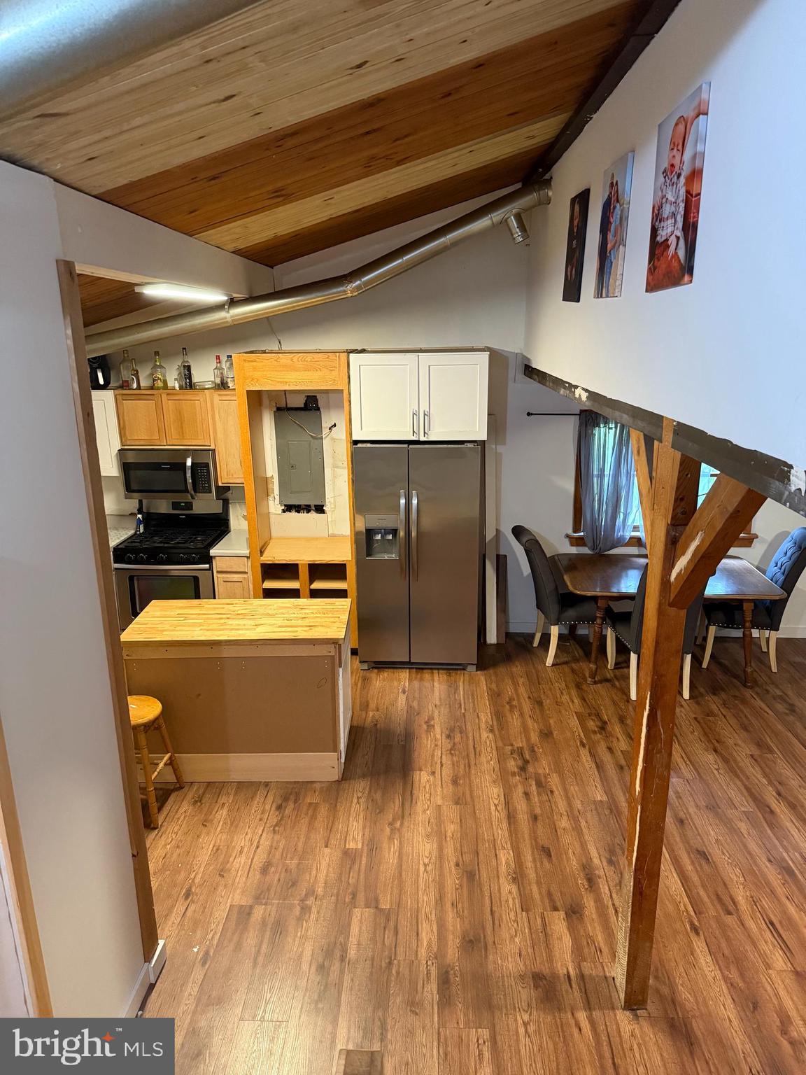 1915 Bumpass Road Bumpass, VA 23024 - Photo 15 of 17 a view of kitchen with furniture and wooden floor