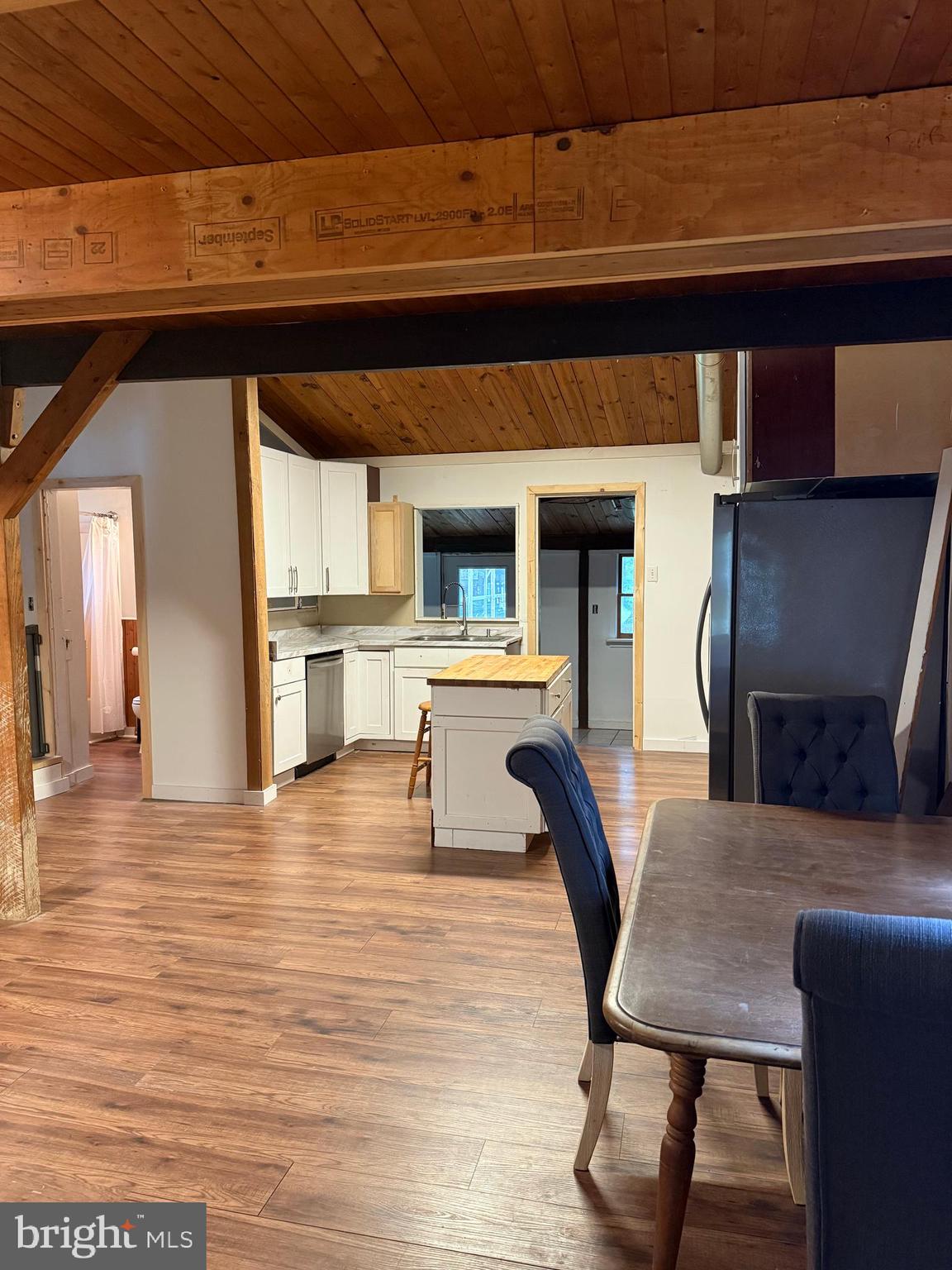 1915 Bumpass Road Bumpass, VA 23024 - Photo 5 of 17 a living room with fireplace furniture and a wooden floor