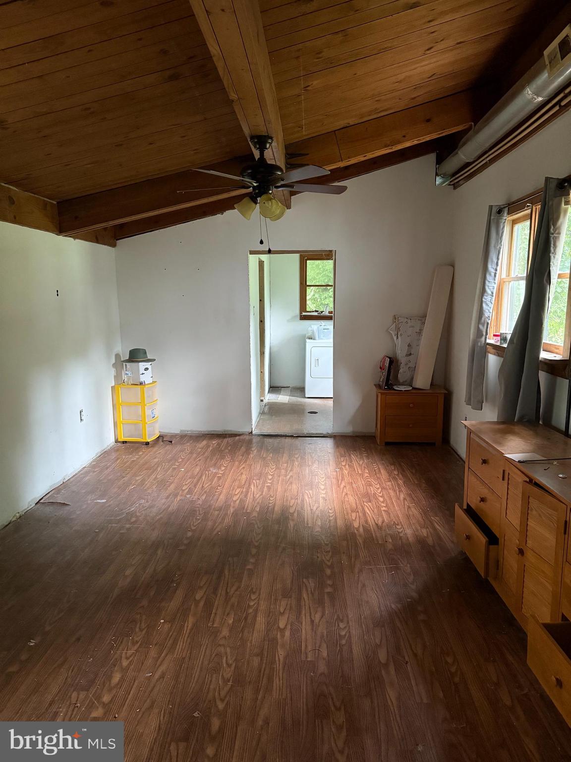 1915 Bumpass Road Bumpass, VA 23024 - Photo 9 of 17 a view of empty room with wooden floor and fan