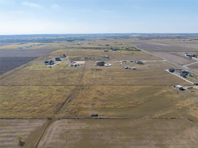 a view of a lake with a yard