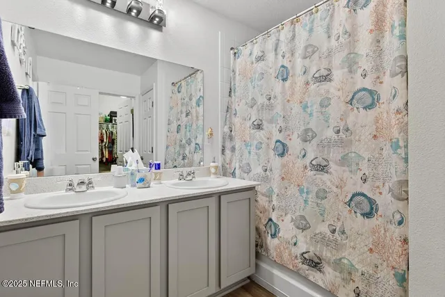 an aerial view of residential house with outdoor space and pool