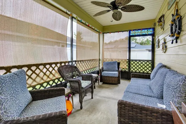 an aerial view of a house with yard swimming pool and outdoor seating