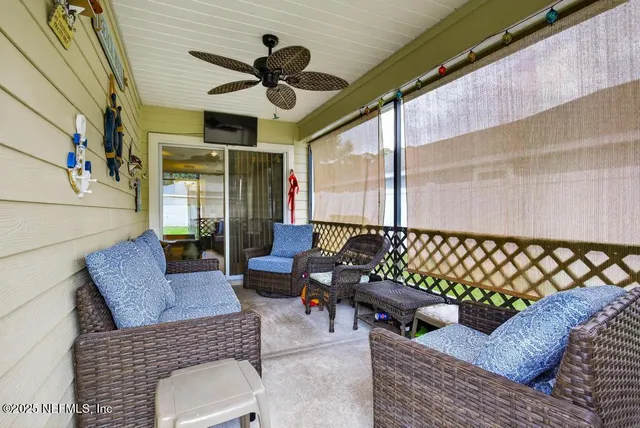 an aerial view of a house with garden space and lake view