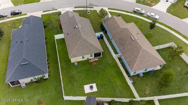 a view of house with garden and lake view