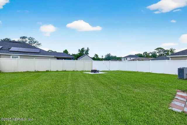 a potted plant sitting in front of a glass door