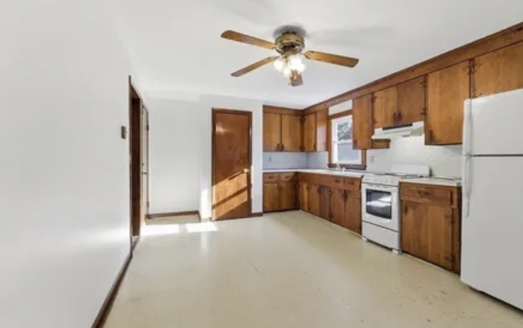 13 Decatur Street, Unit 13 Springfield, MA 01151 - Photo 2 of 7 a view of a kitchen with a sink cabinets and a kitchen