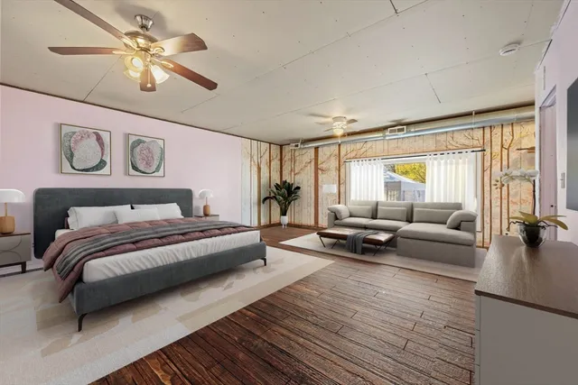 an empty room with windows and chandelier fan