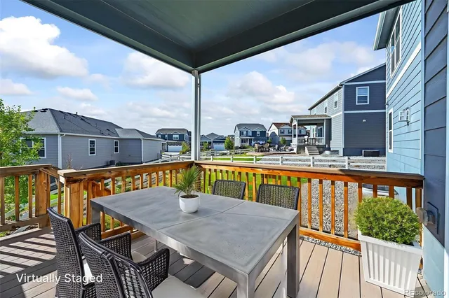 a view of a house with a yard and furniture