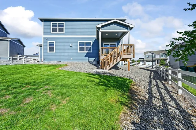 an aerial view of a house with a swimming pool