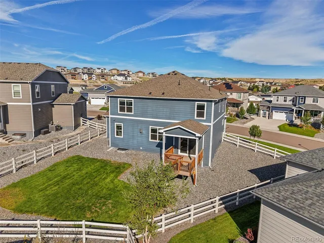 an aerial view of a house with a garden