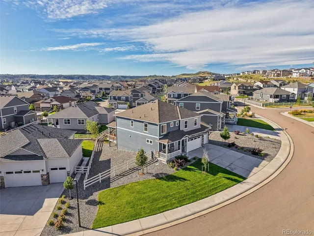 an aerial view of a house with a garden
