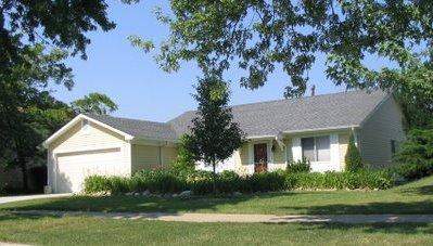 5754 Timberlane Road Matteson, IL 60443 - Photo 1 of 1 a front view of a house with a garden