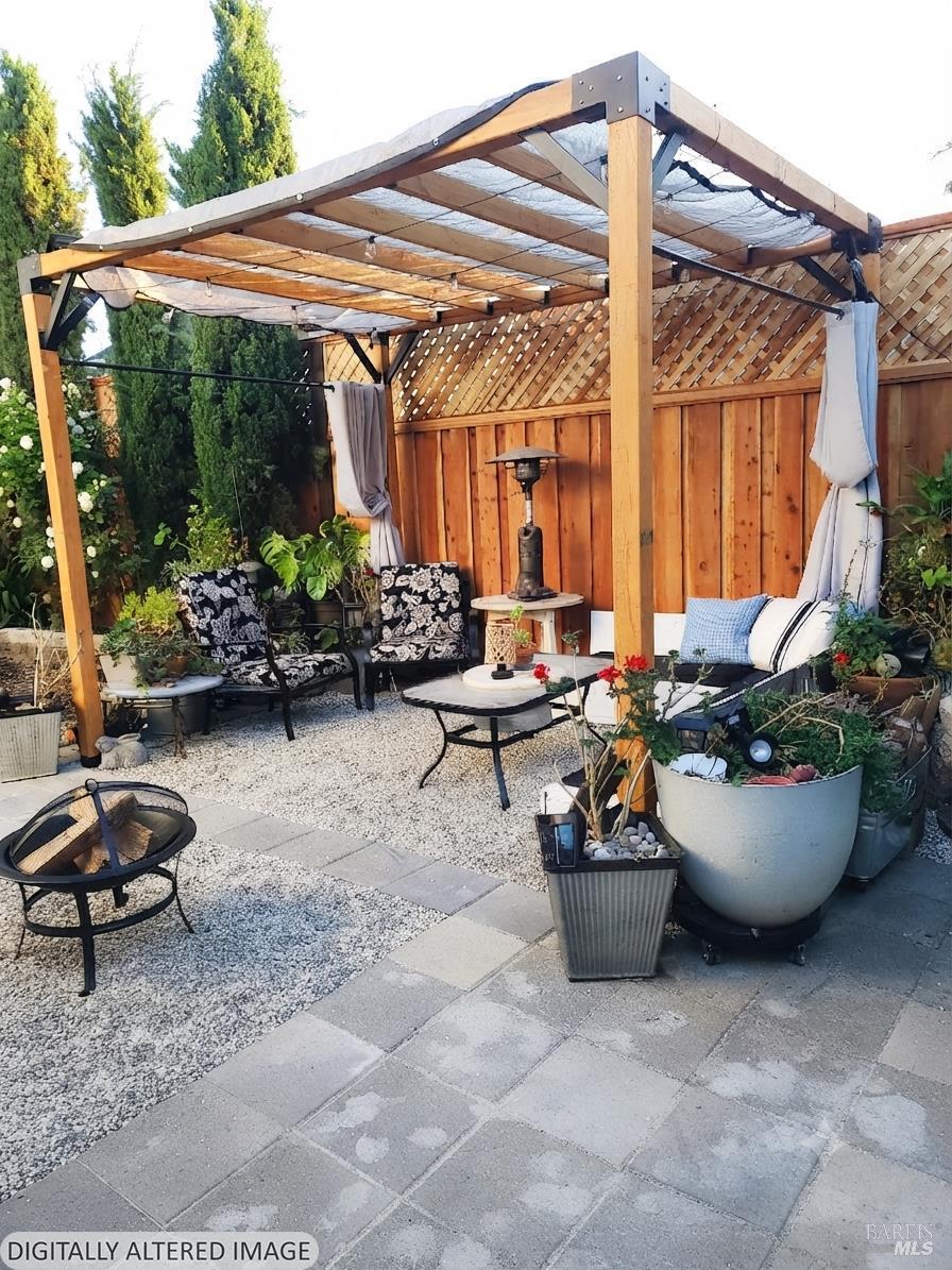 New rear 8' privacy fence and pergola, changed all the pavers and added new salt and pepper pea gravel for a fresh look.