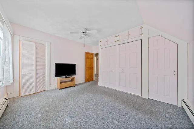 a view of livingroom with furniture and tv