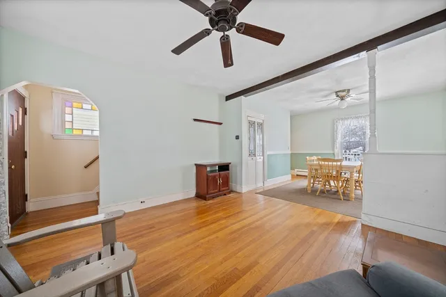 a bedroom with furniture and a window