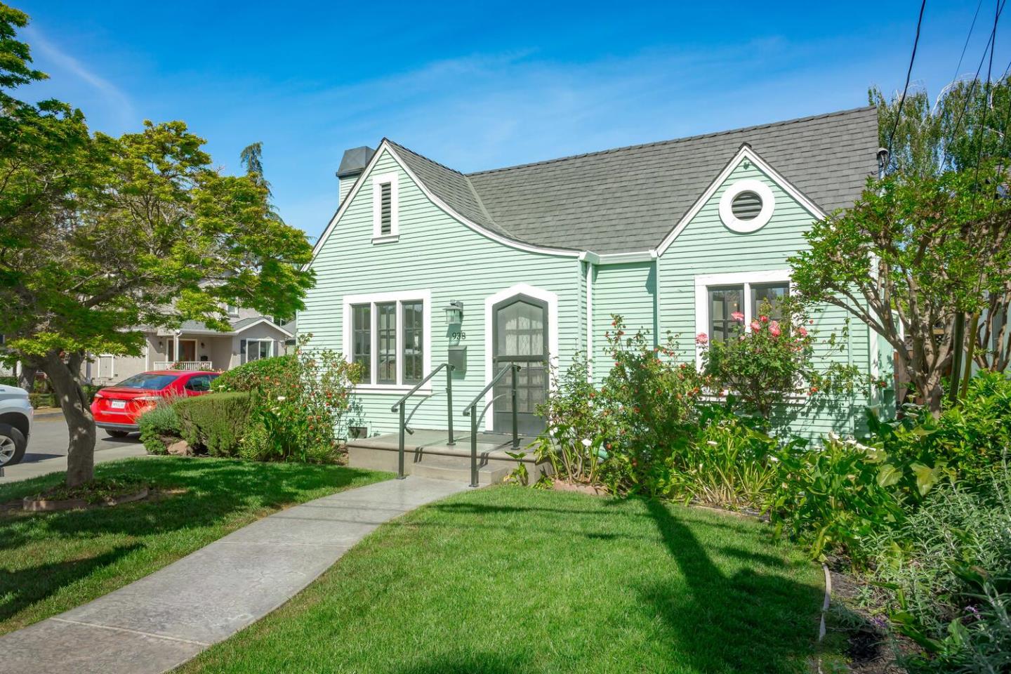 a view of a house with a yard and garden