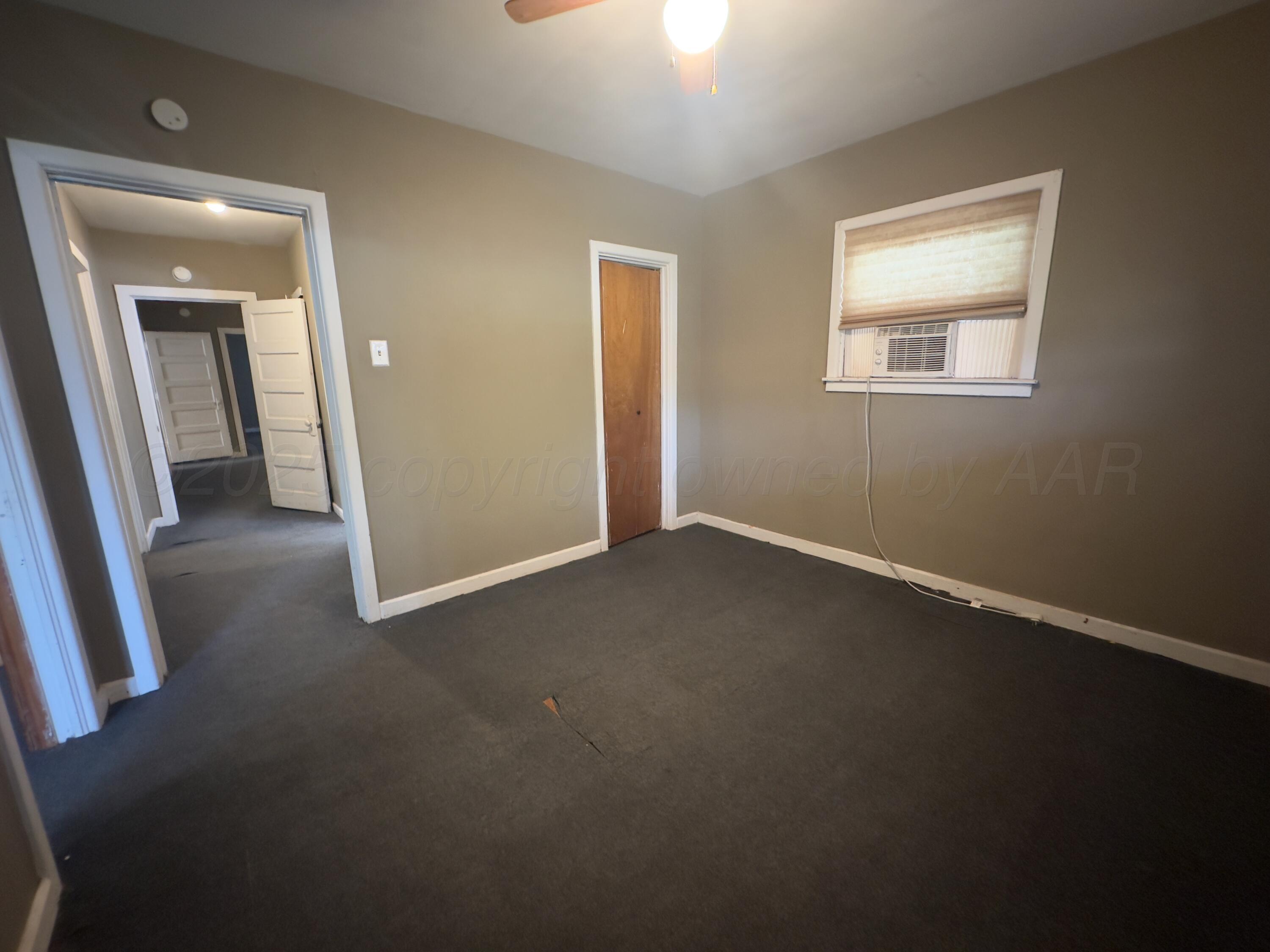 412 North 11th Street Memphis, TX 79245 - Photo 13 of 14 an empty room that has a window
