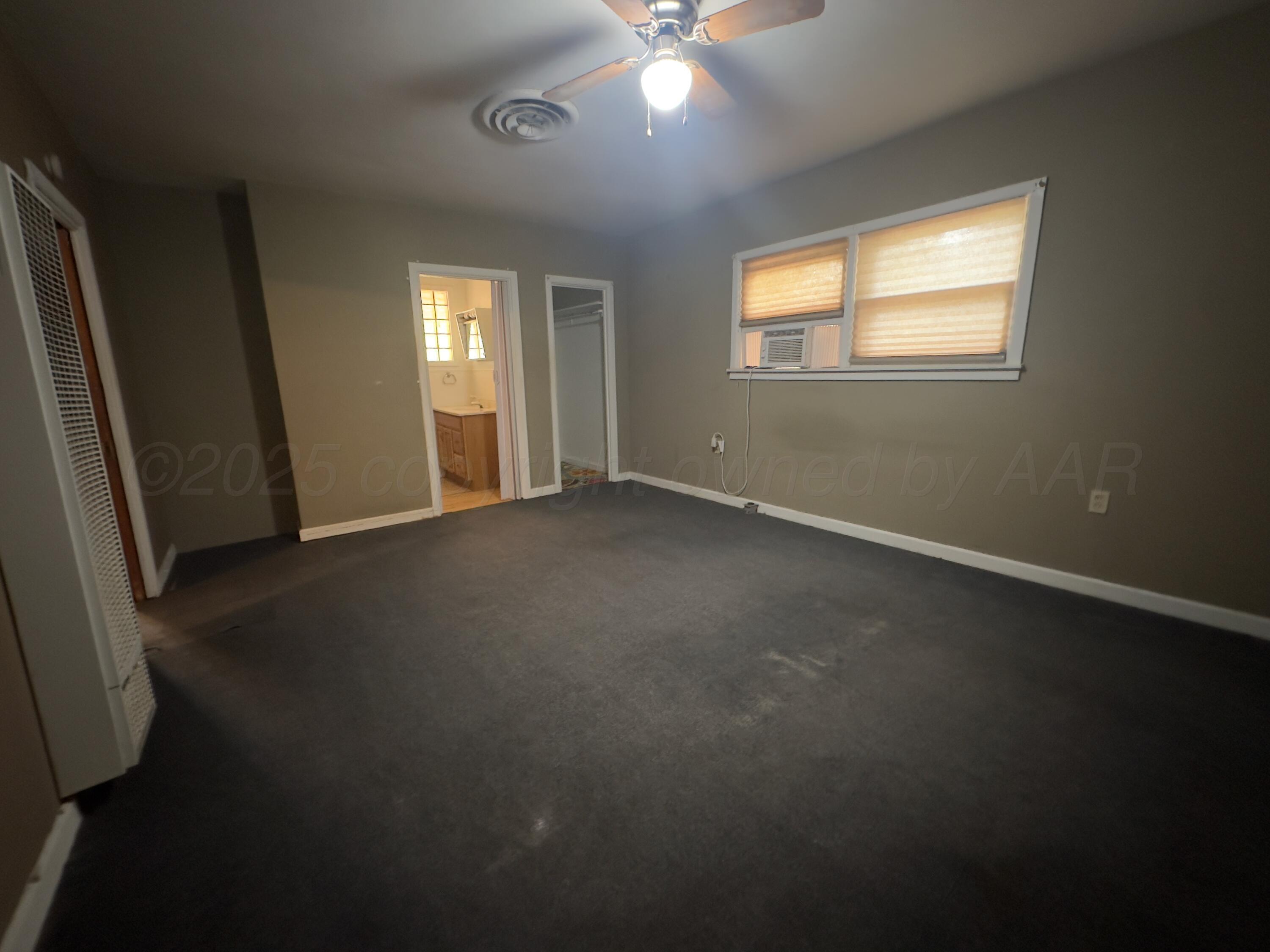 412 North 11th Street Memphis, TX 79245 - Photo 9 of 14 a view of an empty room with a window