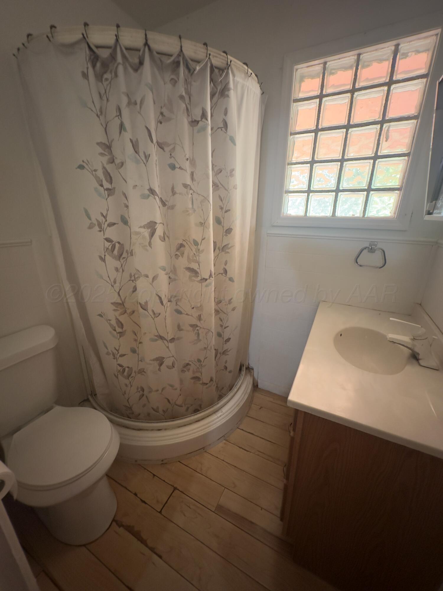 412 North 11th Street Memphis, TX 79245 - Photo 10 of 14 a bathroom with a sink and toilet