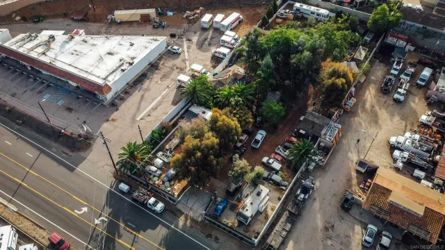 an aerial view of waterside residential houses with outdoor space