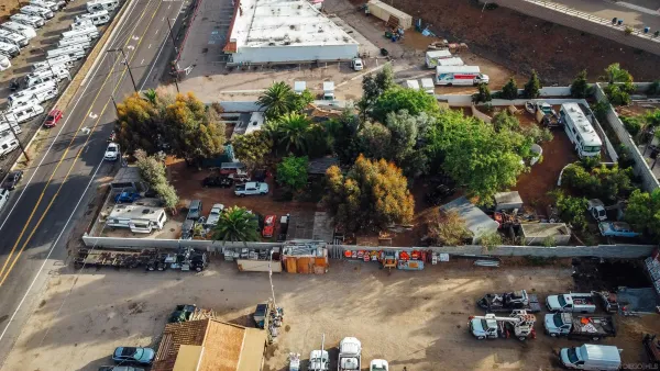 an aerial view of residential house and sandy dunes