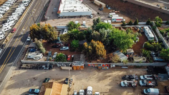 an aerial view of residential house and sandy dunes