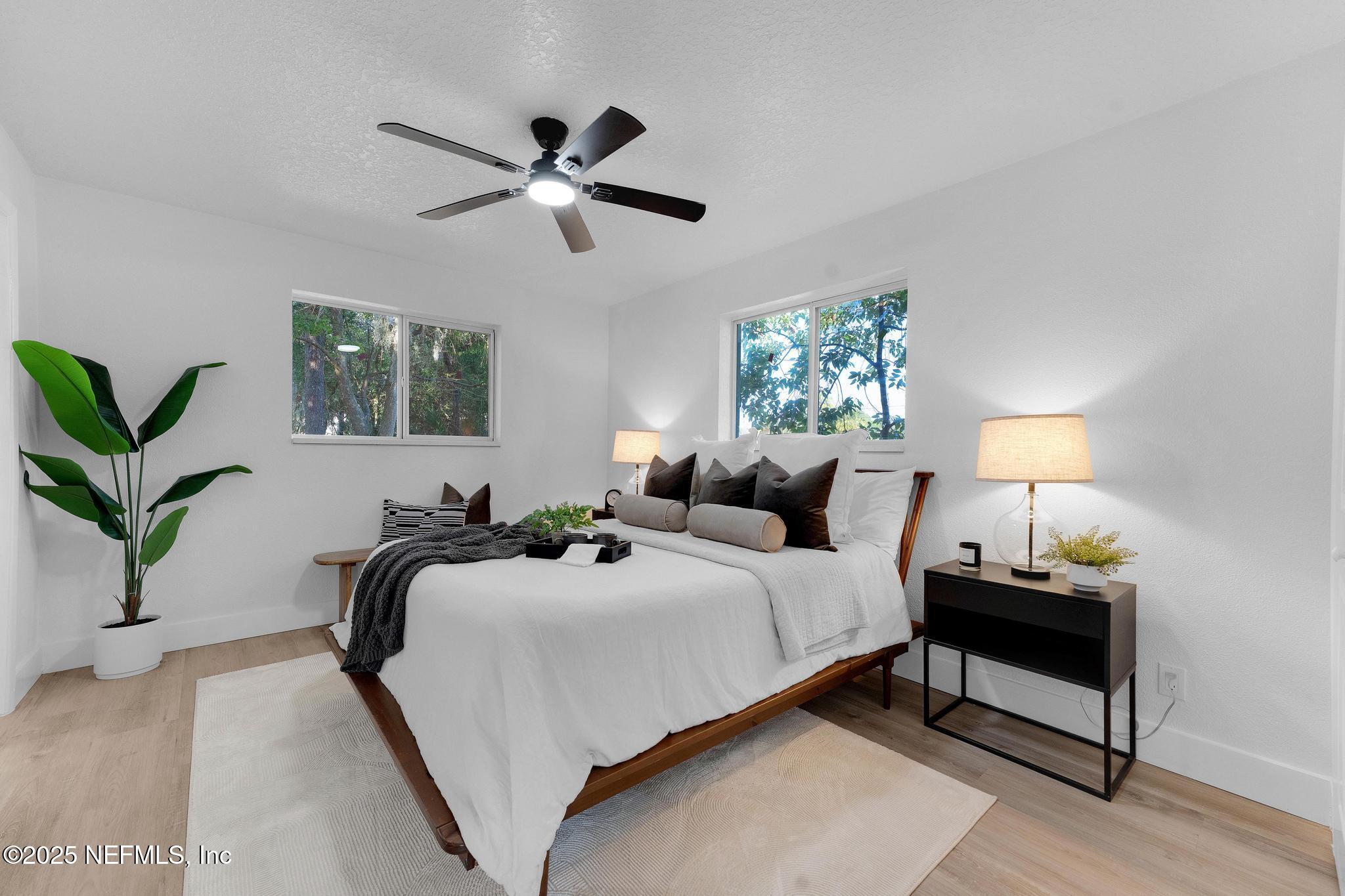 6537 Simca Drive Jacksonville, FL 32277 - Photo 18 of 25 a bedroom with a bed and a window