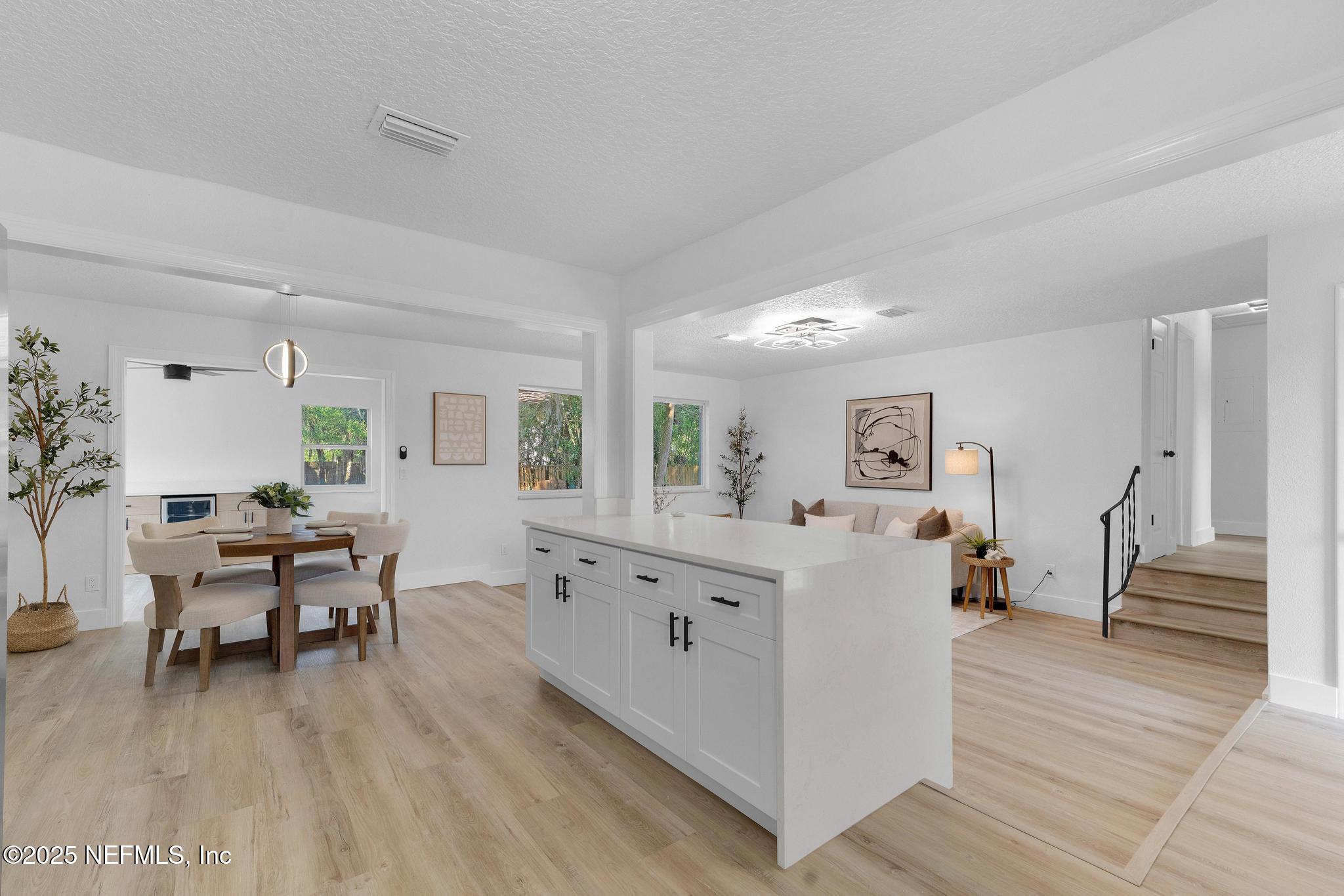 6537 Simca Drive Jacksonville, FL 32277 - Photo 8 of 25 a living room with furniture and a wooden floor