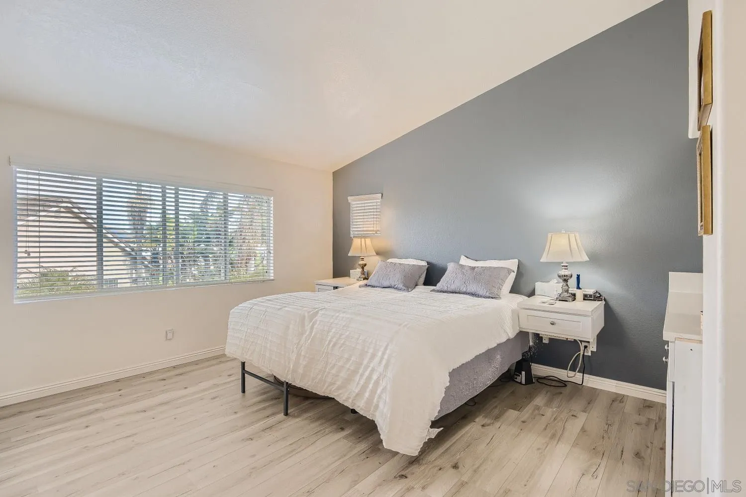 418 Helix Way Oceanside, CA 92057 - Photo 12 of 22 a large bed sitting in a bedroom next to a window