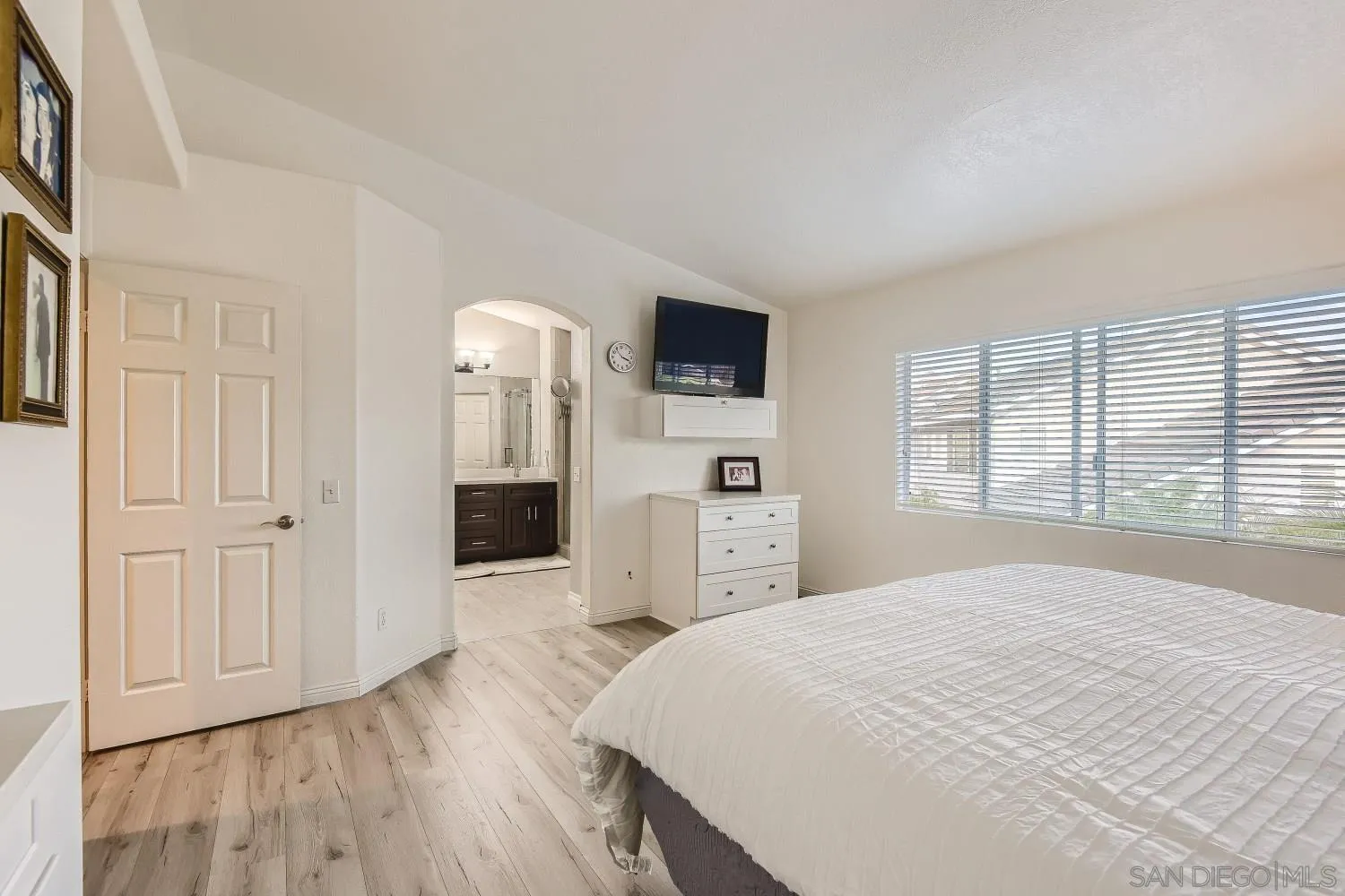 418 Helix Way Oceanside, CA 92057 - Photo 13 of 22 a spacious bedroom with a bed and a flat screen tv