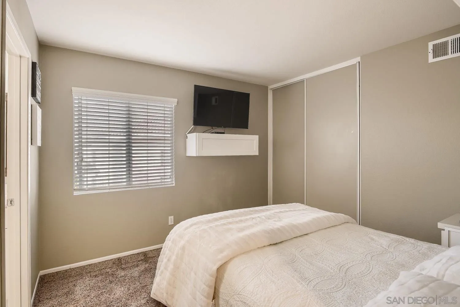418 Helix Way Oceanside, CA 92057 - Photo 16 of 22 a bedroom with a bed and a window