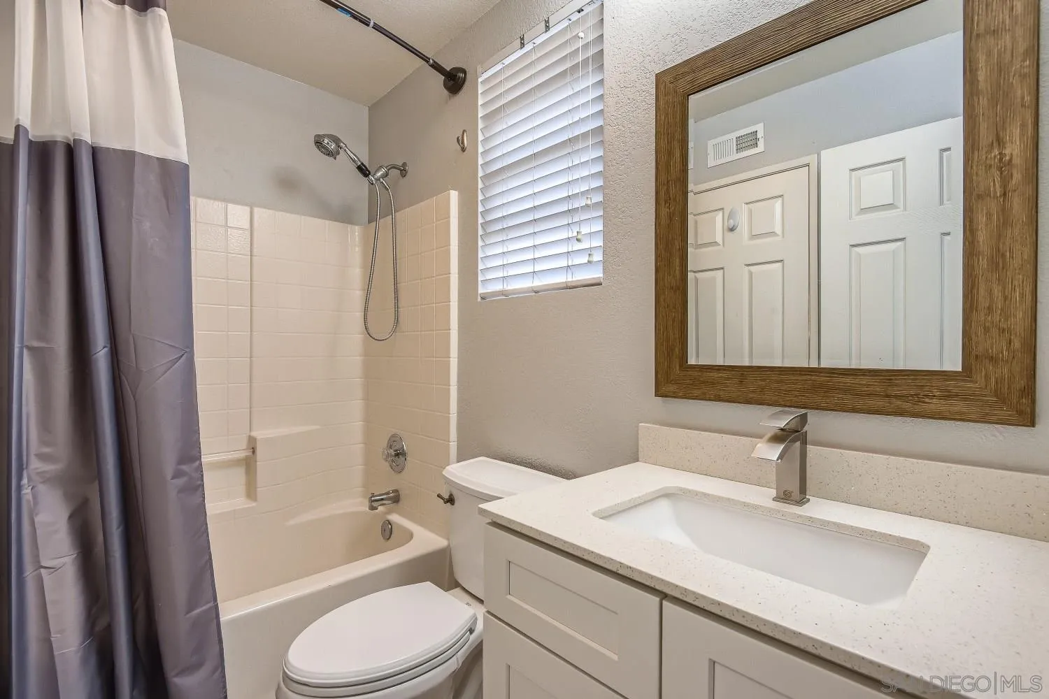 418 Helix Way Oceanside, CA 92057 - Photo 17 of 22 a bathroom with a sink a toilet and shower