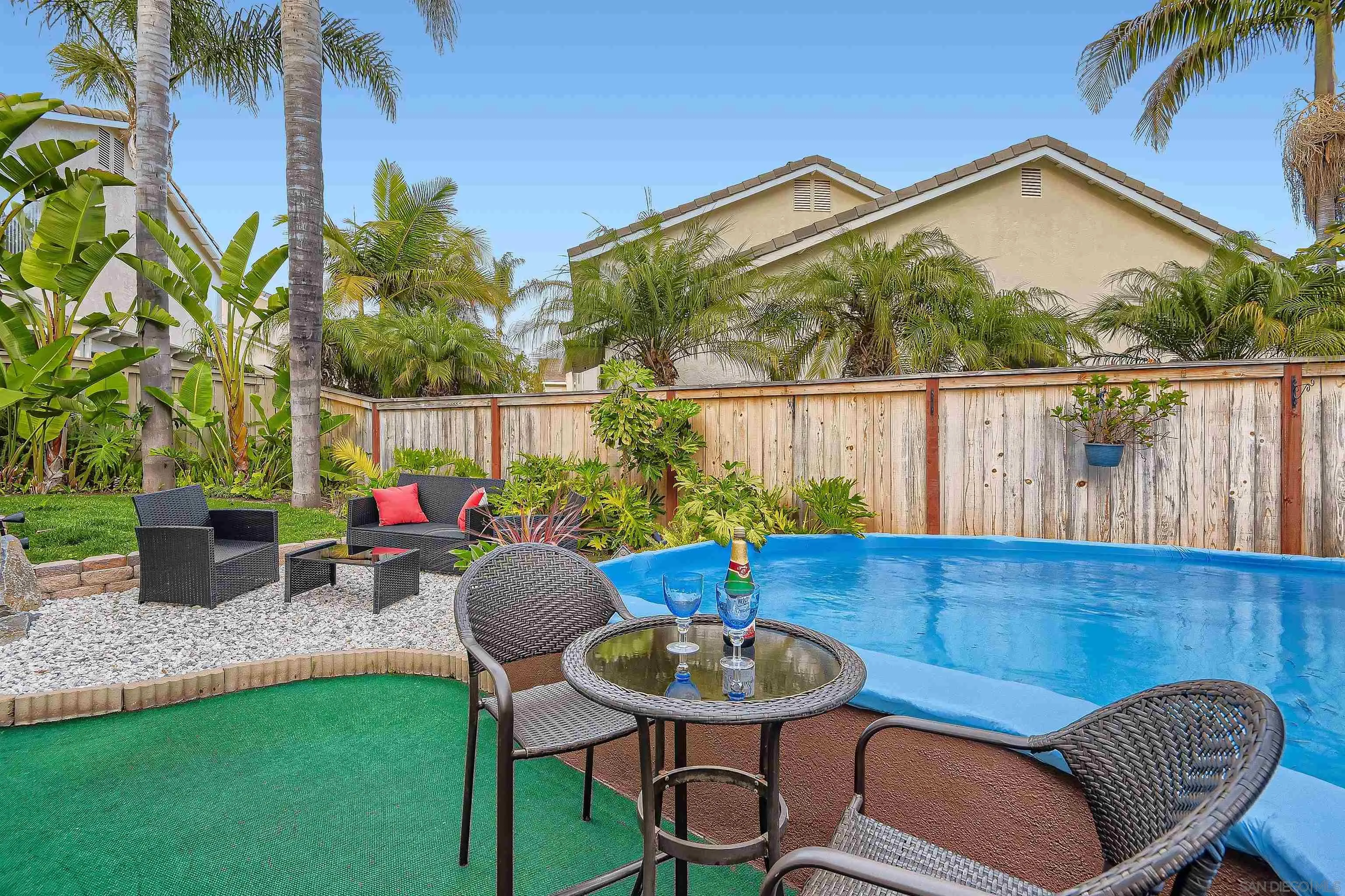 418 Helix Way Oceanside, CA 92057 - Photo 19 of 22 a view of a chair and table in backyard of the house